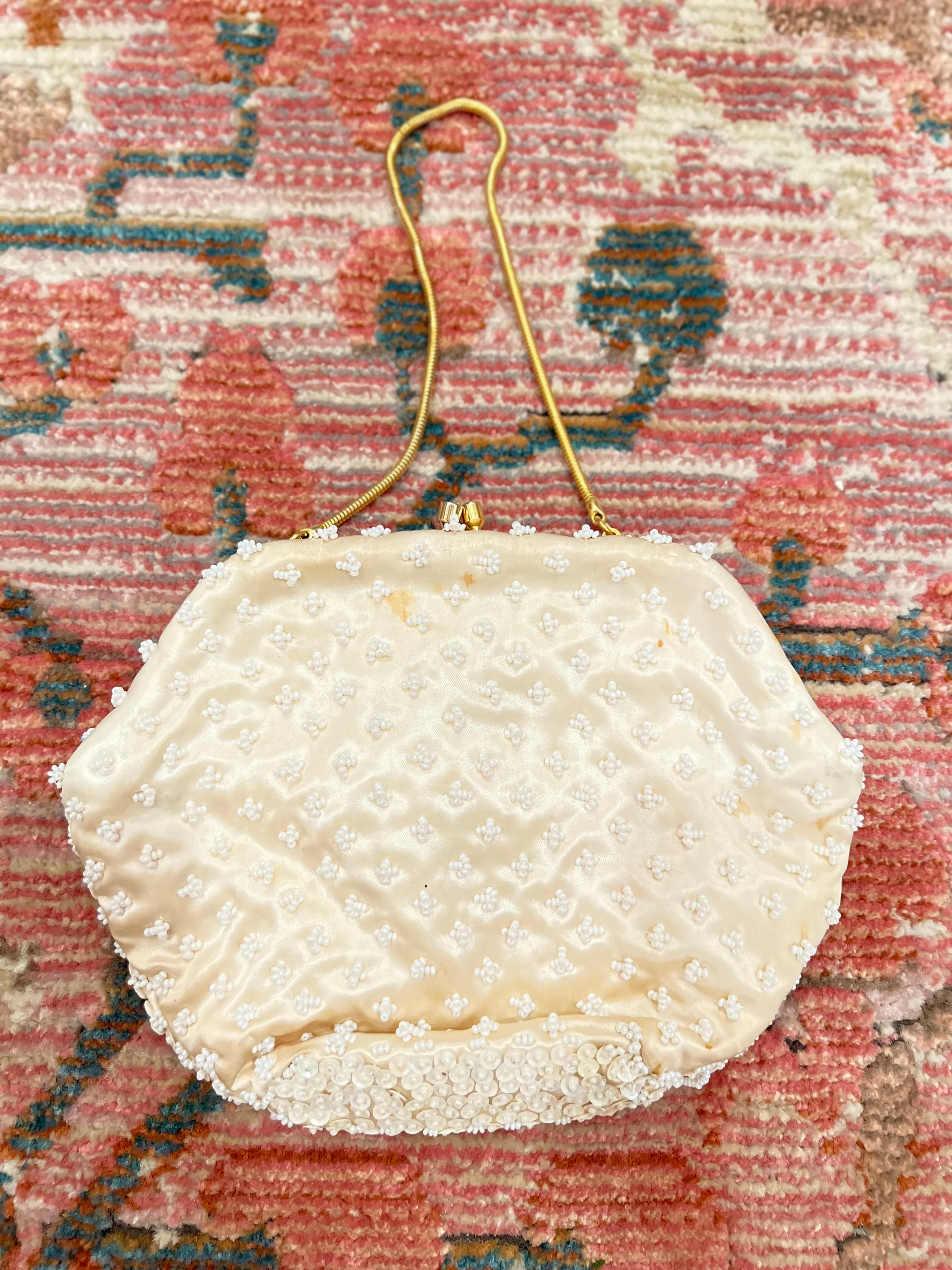 Beaded vine clutch